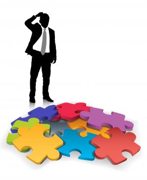 Business man silhouette looking at puzzle pieces to prepare for Negotiation